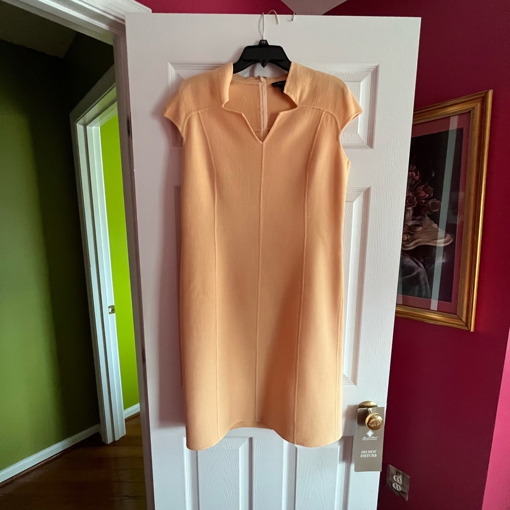 St. John peach colored knee length sleeveless dress.